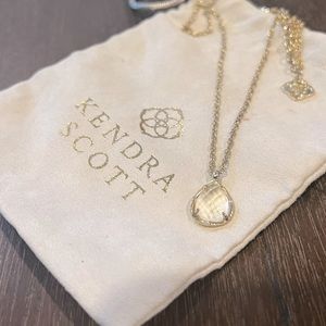 Clear Kendra Scott Kiri teardrop gold necklace.